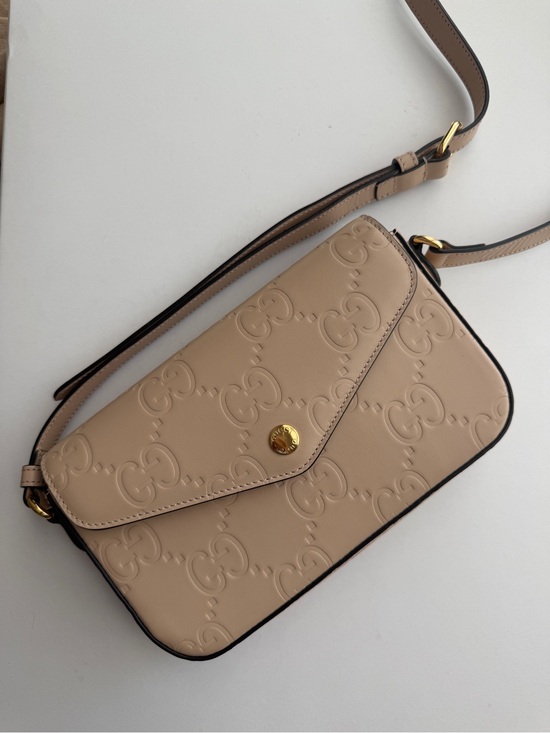 Gucci Handbags - Gucci Beige Embossed GG Leather Crossbody with Gold Hardware